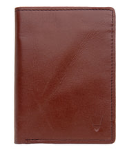 Load image into Gallery viewer, Front view of a closed tan leather bifold wallet with fine stitching & an embossed logo of Hidesign.