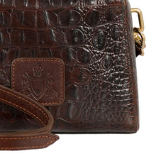 Load image into Gallery viewer, Close-up of Hidesign Ritz 01 brown leather sling bag showing textured leather & embossed logo patch.